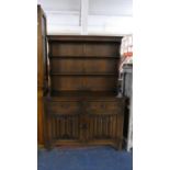 An Oak Linenfold Dresser with Two Drawers and Raised Plate Rack, 126cm Wide