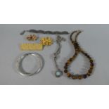 A Collection of Costume Jewellery to Include Silver Bangle, Three Vintage Brooches, Tigers Eye