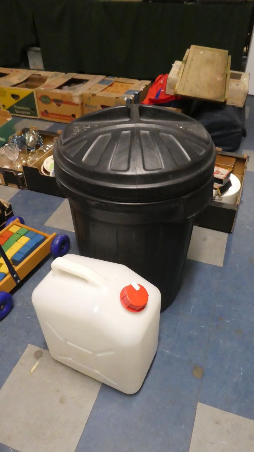 A Plastic Bin, Water Carrier and Soda Stream