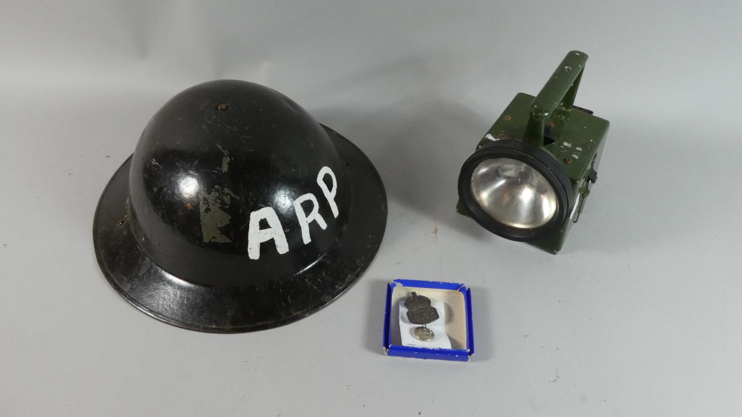 A Collection of WWII ARP Ephemera to Include Helmet, Badge, Button, Torch etc