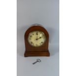 An Edwardian Oak Cased Dome Topped Mantle Clock, the Dial Signed Gilbert, Eight Day Movement, 27cm