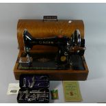 An Oak Cased Singer Sewing Machine with Tools