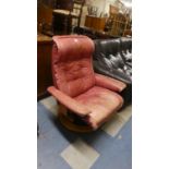 A Vintage Swivel Leather Upholstered Armchair