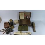 A Vintage Leather Case Containing Binoculars, 12 Bore Military Cartridge Box, Machine Gun Bullet