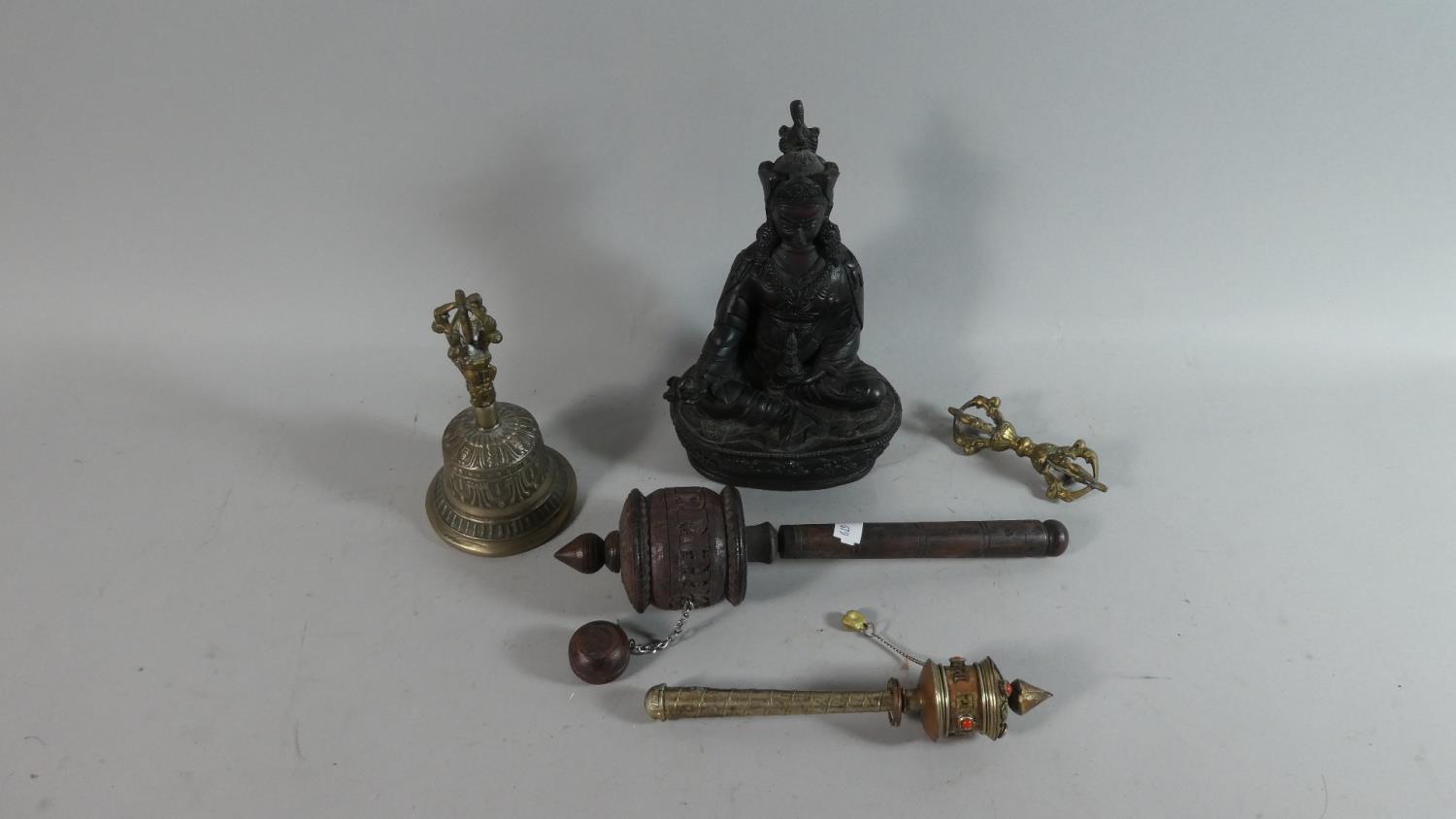 A Resin Study of Seated Buddha, Two Prayer Wheels, Bell etc