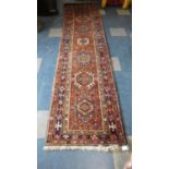 An Antique Hand Made Heriz Runner, 338cm x 82cm