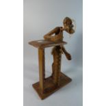 A Carved African Figural CD Rack