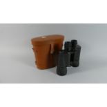 A Pair of Leather Cased 10x50 Field Binoculars