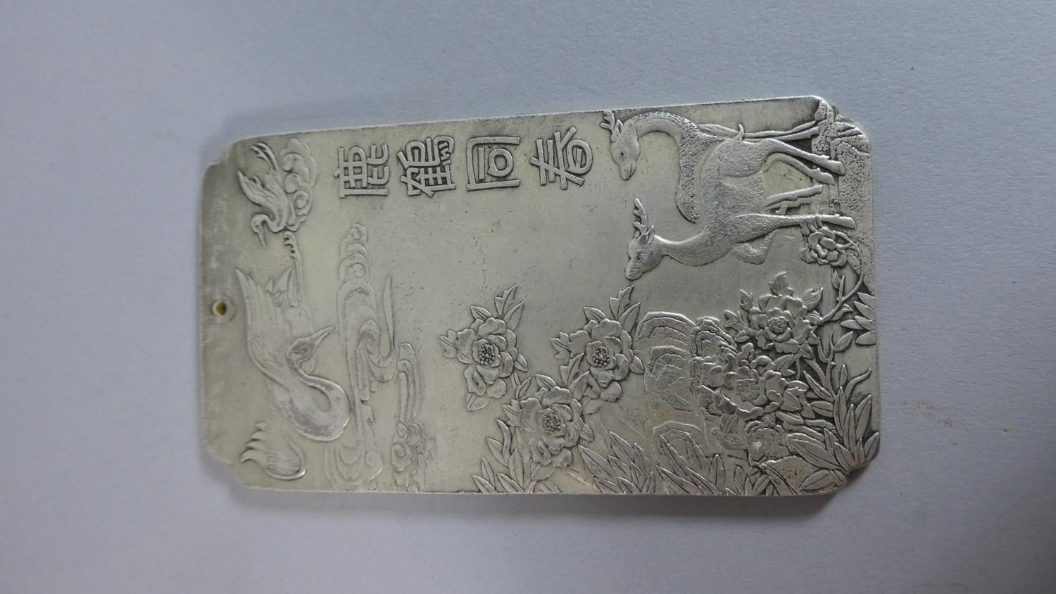 A Chinese Ingot Slab with Deer, Crane and Landscape Decoration in Relief, Character Mark to Reverse,