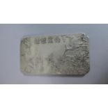 A Chinese Ingot Slab with Deer, Crane and Landscape Decoration in Relief, Character Mark to Reverse,