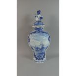 A Large Blue and White Delft Vase and Cover Decorated with River Scene, Lion Finial, 43cm High