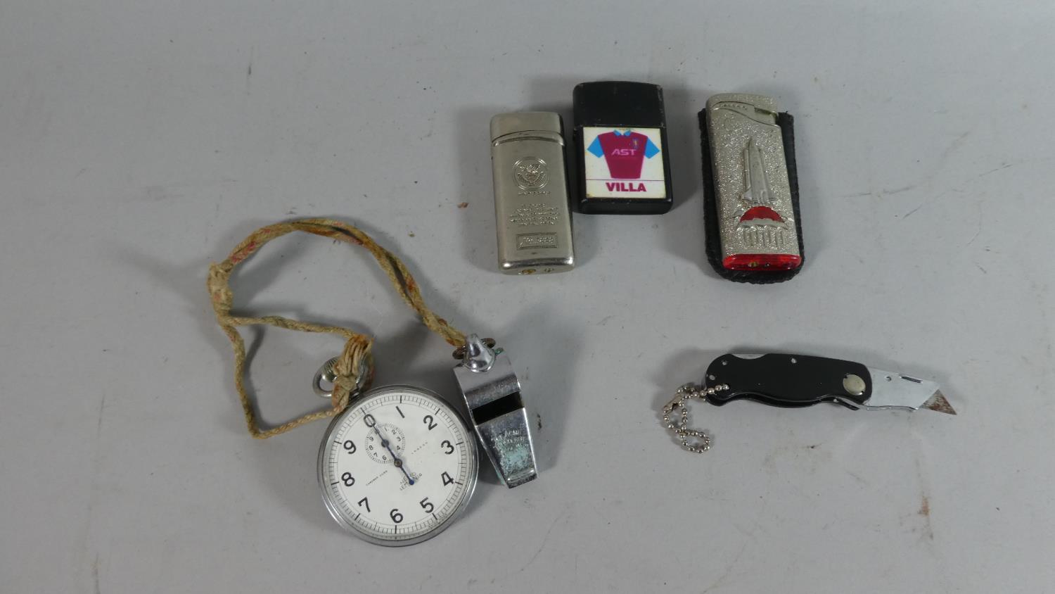 A Collection of Curios to Include Nickle Cased Stopwatch (AF), Two Cigarette Lights, Pen Knife and