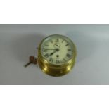 A Good Quality Bulkhead Mounting Brass Circular Ships Clock by Smiths, 'Astral', with Key, Working