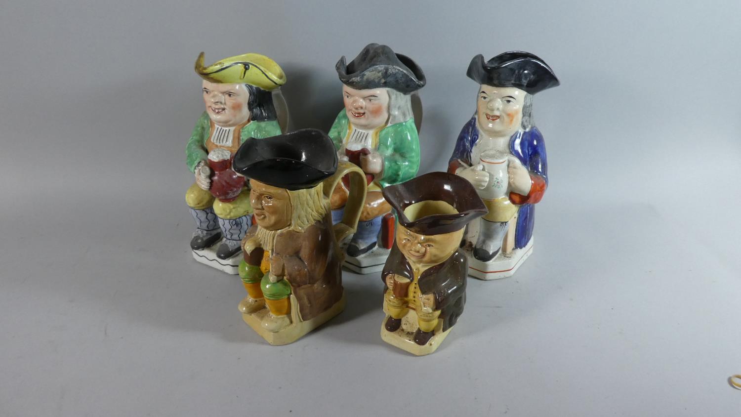 A Collection of Five Staffordshire Toby Jugs