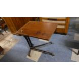 An Adjustable Iron Framed Bed Table, 63cm Wide