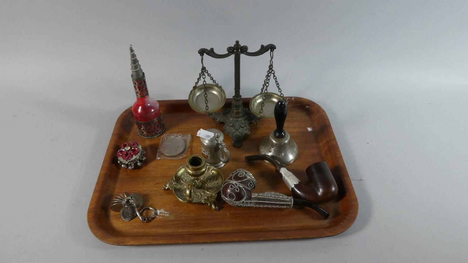 A Tray of Curios to Include Silver Plated Bedchamber Stick, Two Decorated Pipes, Hand Bell,