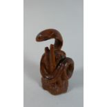 A Carved Wooden Netsuke in the Form of a Cobra Among Bamboo, 5.5cm High