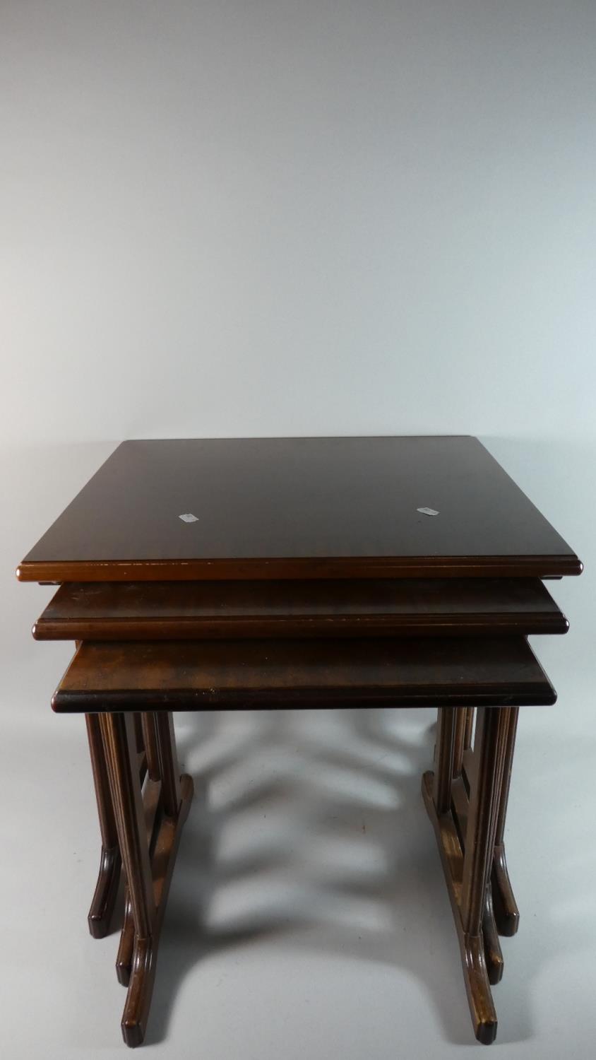 A Modern Nest of Three Mahogany Tables, 53cm Wide