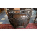 A Late 19th Century Carved Oak Low Hall Stand with Centre Cupboard Flanked by Stick Stand and