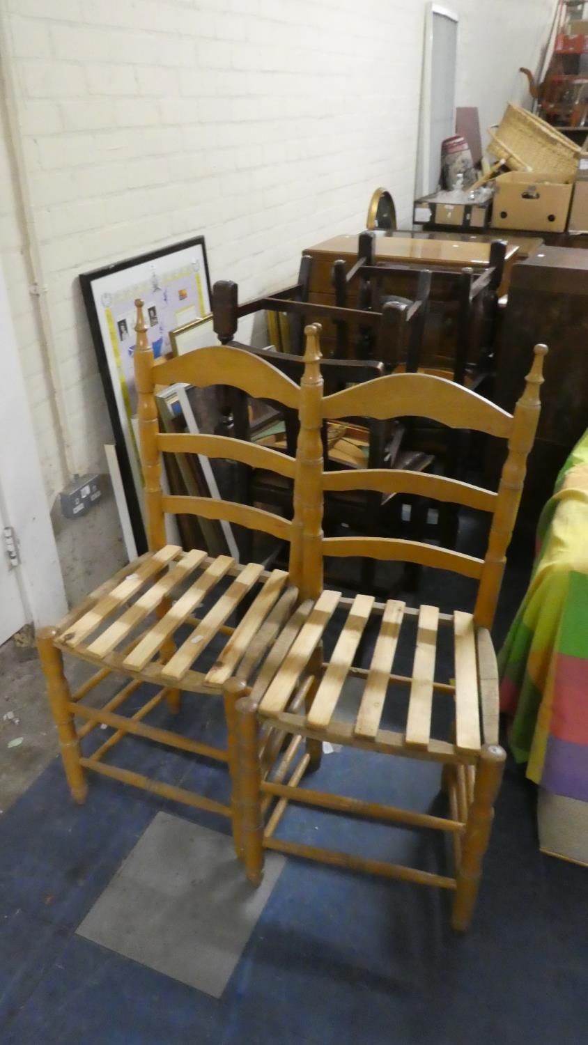 A Pair of Pine Ladder Back Chairs