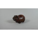 A Carved Wooden Netsuke in the form of a Portly Pig, 5cm Wide