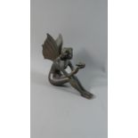 A Bronzed Metal Study of Seated Fairy with Butterfly, 17.5cm High