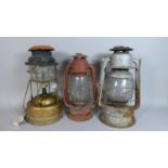 A Collection of Three Hurricane Lamps