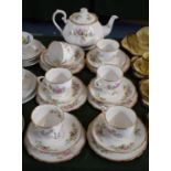 A Roslyn Ming Rose Tea Set Comprising Six Trios and a Teapot