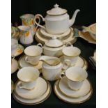 A Collection of Minton St. James Pattern Tea and Dinnerwares to Include Four Dinner and Four Side