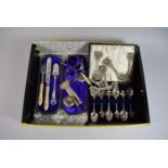 A Box Containing Silver Plated and Glass Tablewares to Include Souvenir Spoons, Knife Rests,