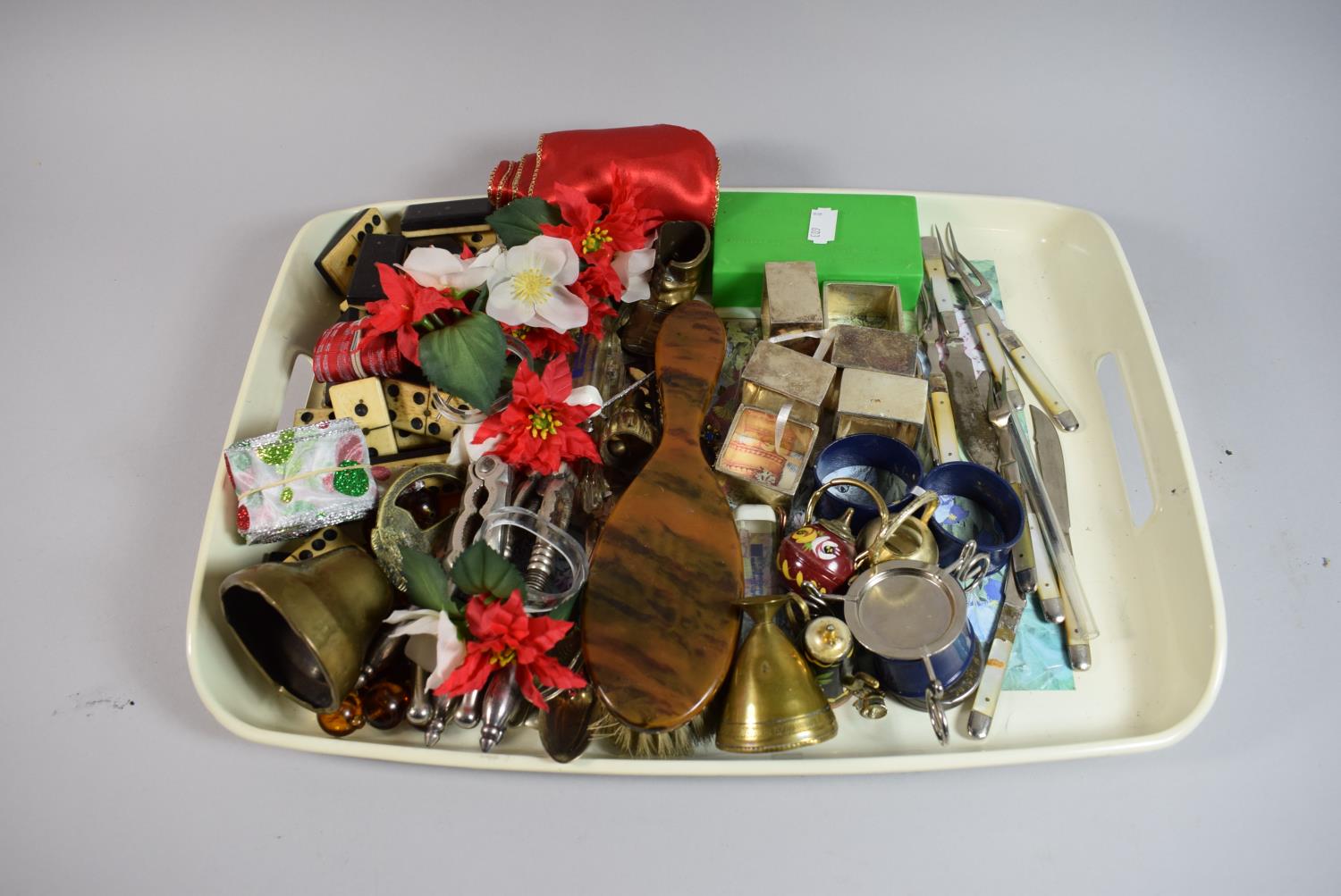 A Tray of Curios to Include Lands End Bell, Dominoes, Square Silver Plated Napkin Rings, Fruit