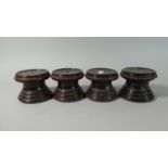 A Set of Four 19th Century Treacle Glazed Terracotta Furniture Stands, Each 10cm Diameter