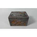 An Oriental Copper Mounted Wooden Box Decorated in Relief with Pagoda, Birds and Trees, Signed to