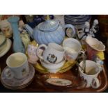 A Tray of Ceramics to Include Continental Figural Ornaments, Teacups, Coronation Mugs, Decorated