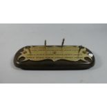 A Late Victorian Brass Mounted Cribbage Board with Four Pegs, 29cm Long