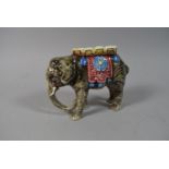 A Continental Glazed Ceramic Vase in the Form of a Elephant Caparisoned with Decorative Pink and