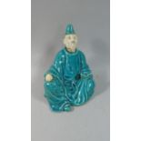A Glazed Figural Ornament of Seated Monk with Book, 23cm High