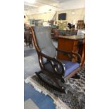 A Victorian Mahogany Framed Scroll Arm Rocking Chair for Restoration