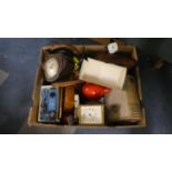 A Box of Sundries to Include Mantle Clocks, Button Hole Tool, Lawn Bowls, Etc
