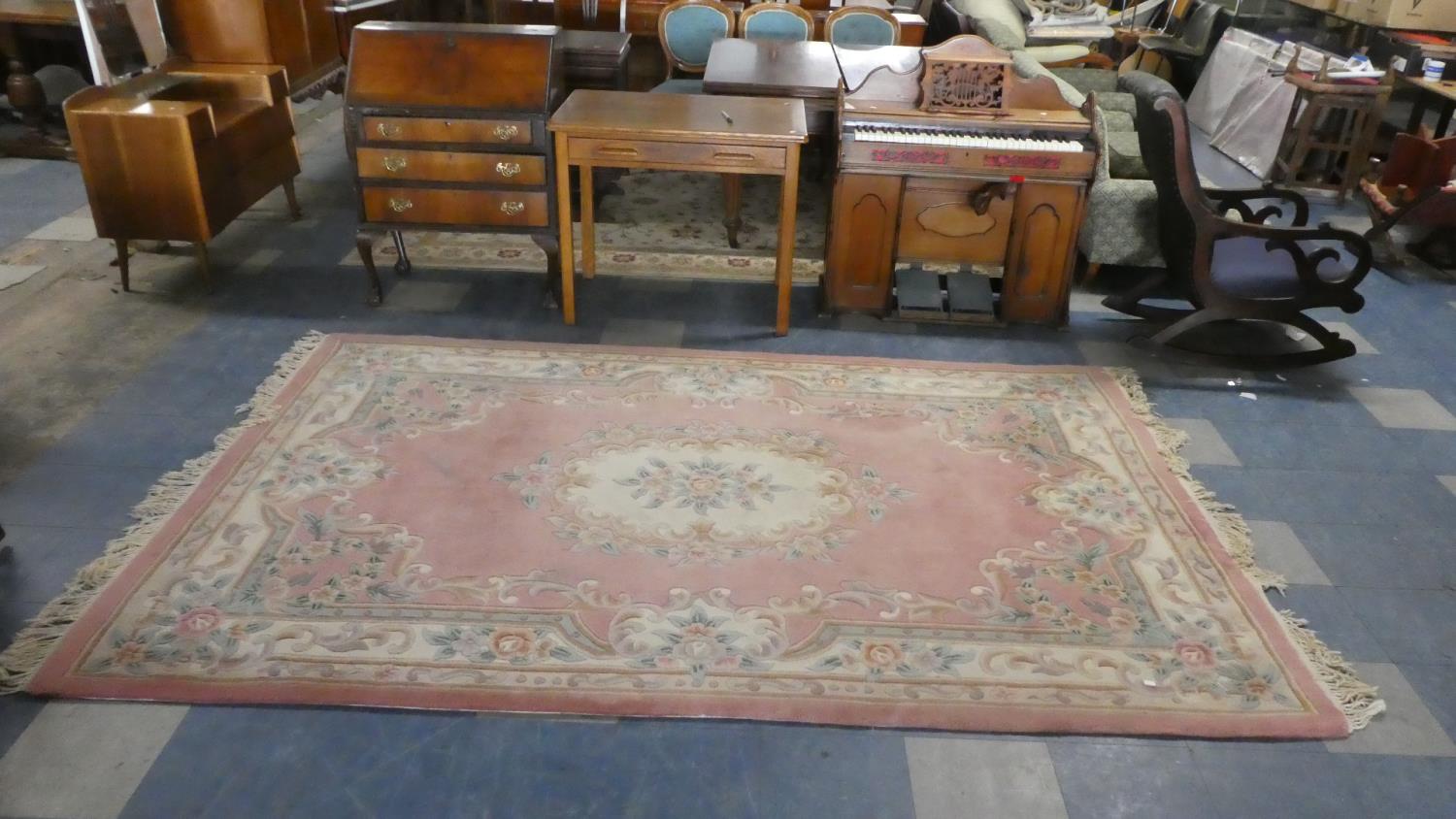 A Chinese Rectangular Woollen Rug on Pink Ground, 300cm x 180cm