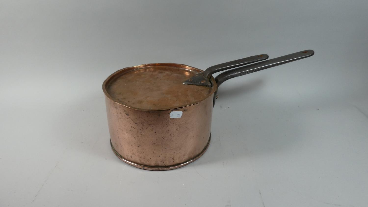 A Victorian Copper Lidded Saucepan with Iron Handles, 25cm Diameter