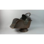 A Copper Helmet Shaped Coal Scuttle