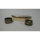 A Silver Mounted Clothes Brush and Two Silver Napkin Rings