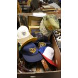 A Box Containing American Hats, Leather Belts, Pictures and Prints etc