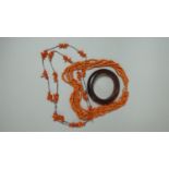 An Amber Bangle and Two Strings Coral