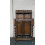 A Continental Carved Oak Two Division Stick Stand with Metal Tray, 55cm Wide