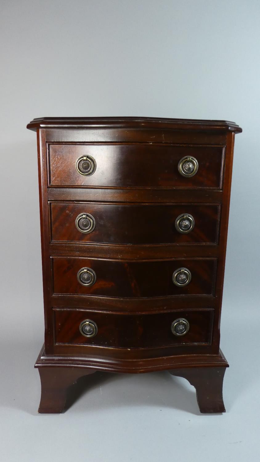 A Small Mahogany Serpentine Front Chest of Four Drawers On Bracket Feet, 40cm Wide and 61cm High
