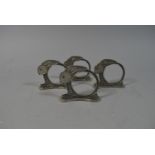 A Collection of Four Vintage Metal Napkin Rings in the Form of Bunny Rabbits