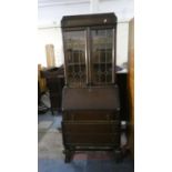 An Edwardian Oak Bureau Bookcase with Three Base Drawers, 76cm Wide