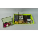 A Tray of Curios to Include Vintage Calculator, Dart Sets, Tea and Cigarette Cards, Tin